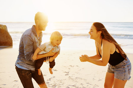 Shot of a happy family having fun at the beach