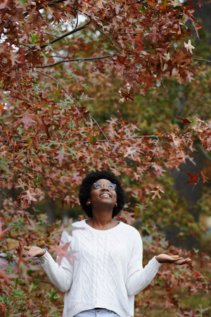 Shot of a young woman enjoying the outdoors on an autumn day