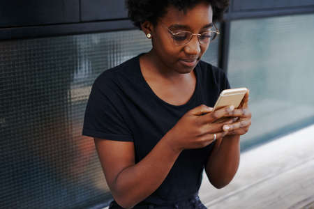 Cropped shot of a young woman in a coffee shopの写真素材