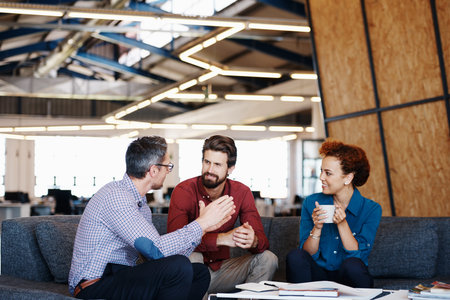Cropped shot of a group of designers brainstorming together in an officeの写真素材
