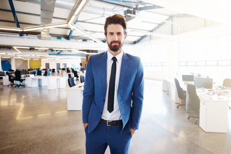 Portrait of a confident and successful young businessman working in a modern office