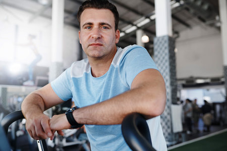 Portrait of a mature man exercising on the treadmill at the gym