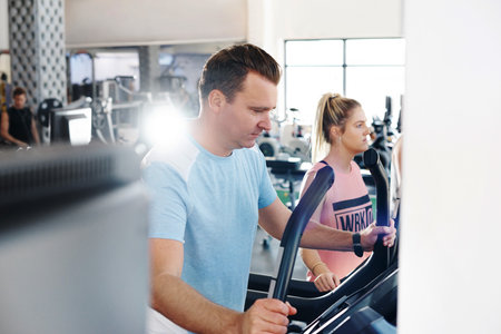 Shot of a mature man exercising on a treadmill in a gymの写真素材