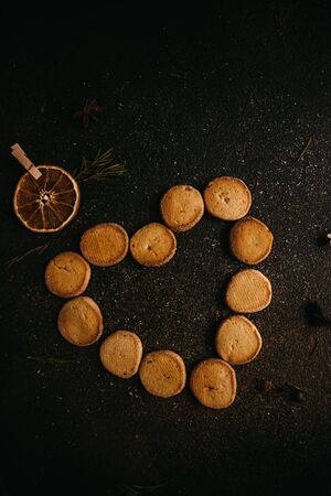 home cookies on a dark texture background to the Valentine's Dayの写真素材