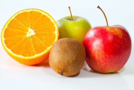 Two apples accompanied by a whole kiwi and a sliced orangeの写真素材