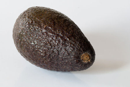 Whole avocado isolated on a white background