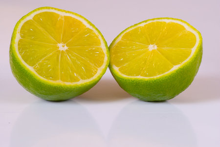 Lime split in half isolated on a white background