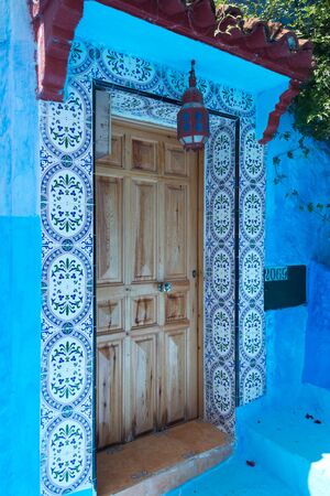 front door in blue town chefchaouen, moroccoの写真素材