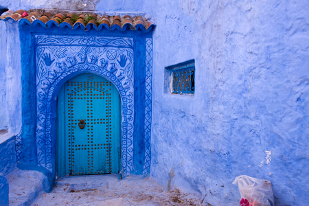 front door in blue town chefchaouen, moroccoの写真素材