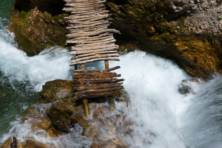 stick bridge over mountain creek in rif mountains, Talassemtane National Park,  moroccoの写真素材