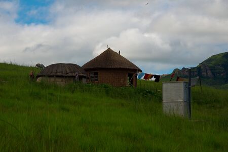 rural homestead with pit latrine in drakensberg mountains, kwazulu natal, south africaの写真素材