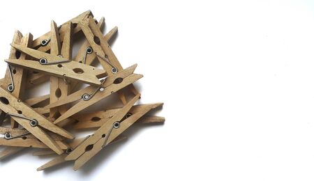 Wooden clothes clips on white  backgroundの写真素材