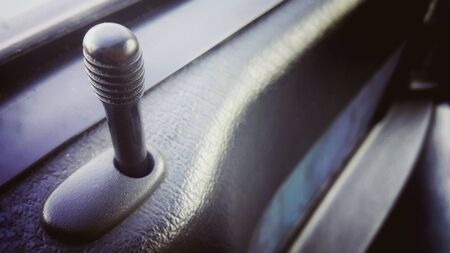 Close up interior car door lock buttonの写真素材