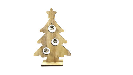 Christmas tree made from wood decorated with small bells isolated on white background. home...