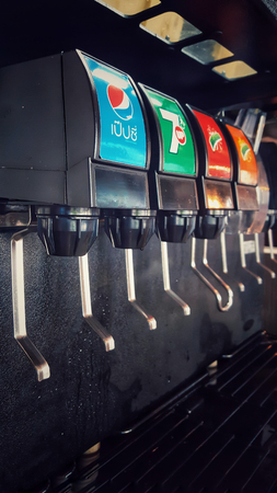 Bangkok, Thailand - November 2, 2018 - Soft drink dispenser. There are many brands of sparkling soda water.のeditorial素材