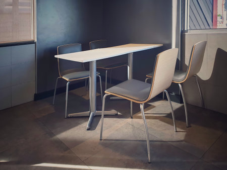 Chairs and table in the empty restaurant.The sun shines into the dining room. Sunlight hits objects.