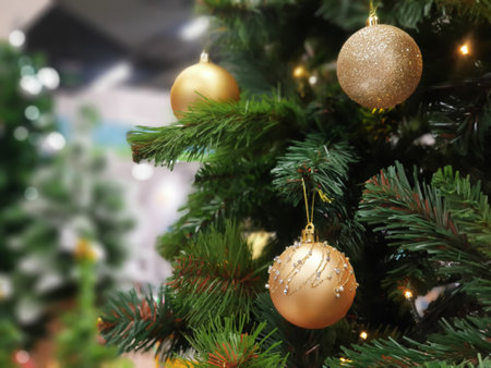 Christmas tree decorated with beautiful ornaments,celebrate the christmas season.garland background and xmas wallpaperの写真素材