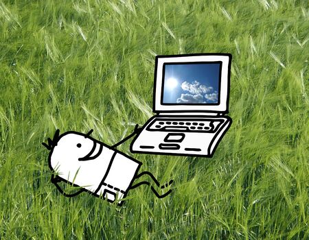 Cartoon character - Man in a field with laptopの写真素材