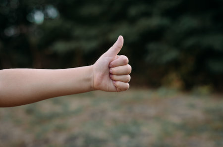 A child's hand shows a gesture of approval. Fingers up. Hand shows a class of gestures. Everything...