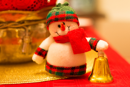 Christmas decoration tiny snowman on a table closeup の写真素材