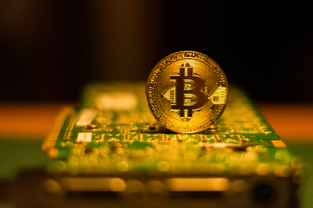 Bitcoin graphic card mining on a blurry dark backgroundの写真素材