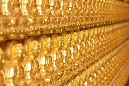 Temple wall with Buddha の写真素材