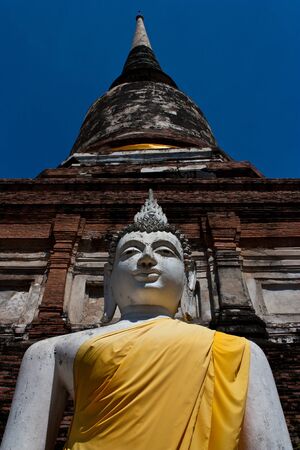 Statue of Buddha with Phra Chedi Chaimongkolの写真素材