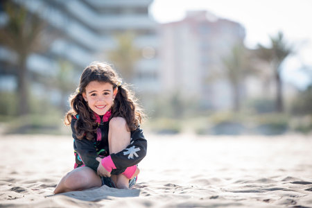 Little girl on vacation posing on the beachのeditorial素材