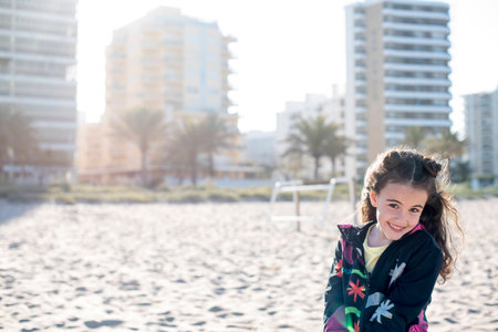 Little girl on vacation posing on the beachのeditorial素材
