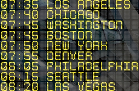 Close-up of an airport departure board to usa cities destinations, with environment reflection.Part...