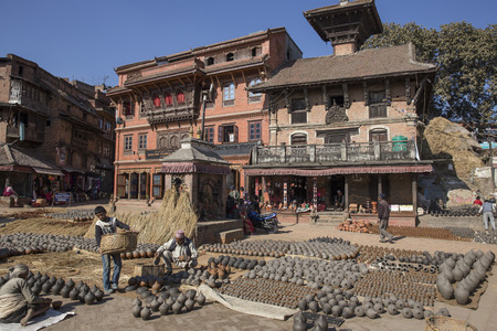 BHAKTAPUR, NEPAL - DECEMBER 02, 2013  unidentified people who work handcrafted Pottery on December 2, 2013 in Bhaktapur, Kathmandu Valley, Nepalのeditorial素材