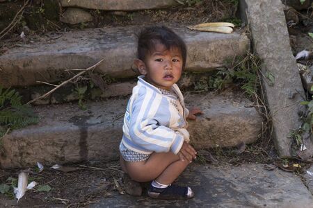 KATHMANDU, NEPAL - DECEMBER 2, 2013  an unidentified child in the backyard on December 2, 2013 in Changu Narayan, Kathmandu valley, Nepalのeditorial素材