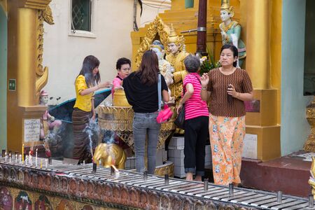 YANGON MYANMAR NOVEMBER 22 2014: many unidentified people pray at the Shwedagon Pagoda in Yangon Myanmarのeditorial素材