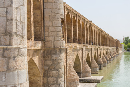 ISFAHAN IRAN APRIL 28 2015: unidentified people resting in the ancient bridge SioSeh Pol The Bridge of 33 Arches in Isfahan Iranのeditorial素材