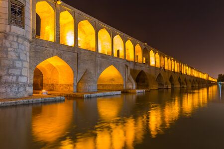 ISFAHAN IRAN APRIL 28 2015: unidentified people resting in the ancient bridge SioSeh Pol The Bridge of 33 Arches in Isfahan Iranのeditorial素材