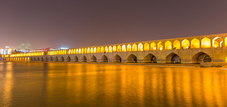 ISFAHAN IRAN APRIL 28 2015: unidentified people resting in the ancient bridge SioSeh Pol The Bridge of 33 Arches in Isfahan Iranのeditorial素材