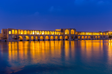 ISFAHAN IRAN APRIL 28 2015: unidentified people resting in the ancient Khaju Khaju Pole Bridge in Isfahan Iranのeditorial素材