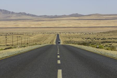 The scenic road B4 in the desert leading to Lderitz, Namibiaの写真素材