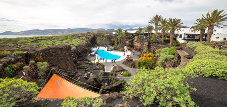 LANZAROTE, SPAIN - NOVEMBER 29, 2016: people at the Jameos del Agua, part of a 6Km long lava tube which formed about 4,000 years ago when the Montana La Corona erupted. The tourist attraction was conceived by Cesar Manrique, during the 1960's in Lanzaroteのeditorial素材