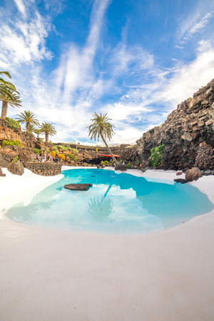 LANZAROTE, SPAIN - NOVEMBER 29, 2016: people at the Jameos del Agua, part of a 6Km long lava tube which formed about 4,000 years ago when the Montana La Corona erupted. The tourist attraction was conceived by Cesar Manrique, during the 1960's in Lanzaroteのeditorial素材