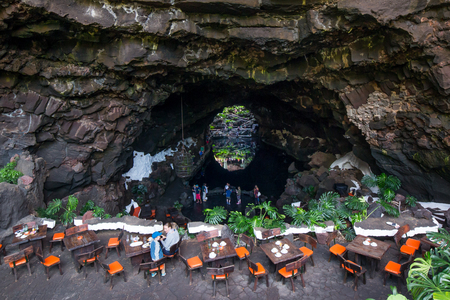 LANZAROTE, SPAIN - NOVEMBER 29, 2016: people at the Jameos del Agua, part of a 6Km long lava tube which formed about 4,000 years ago when the Montana La Corona erupted. The tourist attraction was conceived by Cesar Manrique, during the 1960's in Lanzaroteのeditorial素材