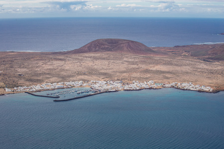 View of Isla Graciosa from Mirador del Rio, in Lanzarote, Canary Islands, Spain. In 1973 Cesar Manrique converted the gun emplacement into a spectacular lookout point.の写真素材