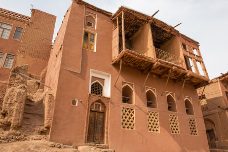 The tipical red mud-brick houses in the ancient village of Abyaneh, near Kashan, in Iranの写真素材