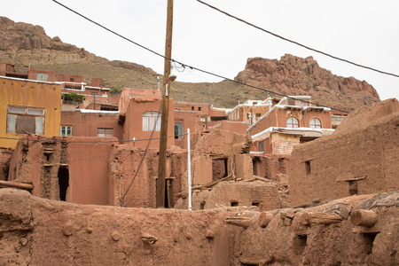 The tipical red mud-brick houses in the ancient village of Abyaneh, near Kashan, in Iranの写真素材