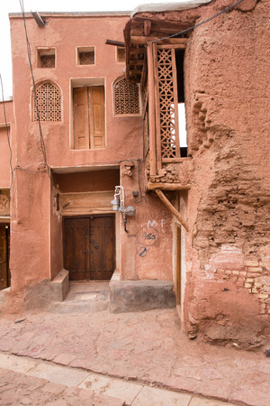 The tipical red mud-brick houses in the ancient village of Abyaneh, near Kashan, in Iranの写真素材