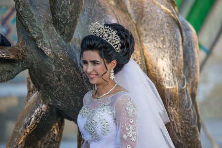 BUKHARA, UZBEKISTAN - AUGUST 27, 2016: a bride after the celebration of a marriage in Bukhara, in Uzbekistanのeditorial素材