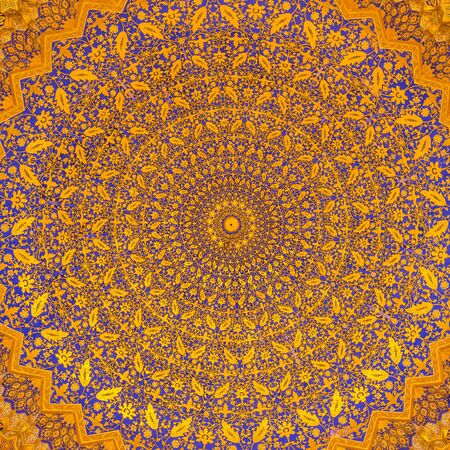 SAMARKAND, UZBEKISTAN - AUGUST 28, 2016: Detail of gold mosaic dome in Tilya Kori Madrasah in...