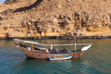 SUR, OMAN - NOVEMBER 25, 2017: Traditional fishing boat  in the bay of Sur, in Oman.