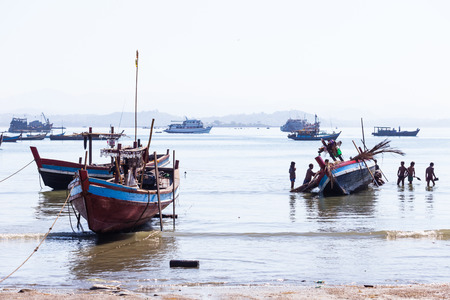 NGAPALI, MYANMAR - DECEMBER 03, 2014: Fishing boats in Thandwe village, Ngapali beach, Myanmarのeditorial素材