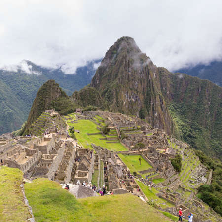 Machu Picchu, Peru - october 06, 2018: View of tourists visiting the ruins of the Lost Incan City of Machu Picchu near Cusco, Peru. Machu Picchu is a Peruvian Historical Sanctuary.のeditorial素材
